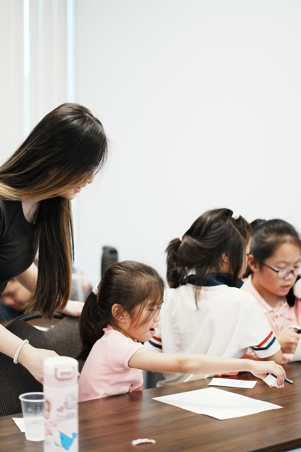 Sarah helping students with a STEM activity